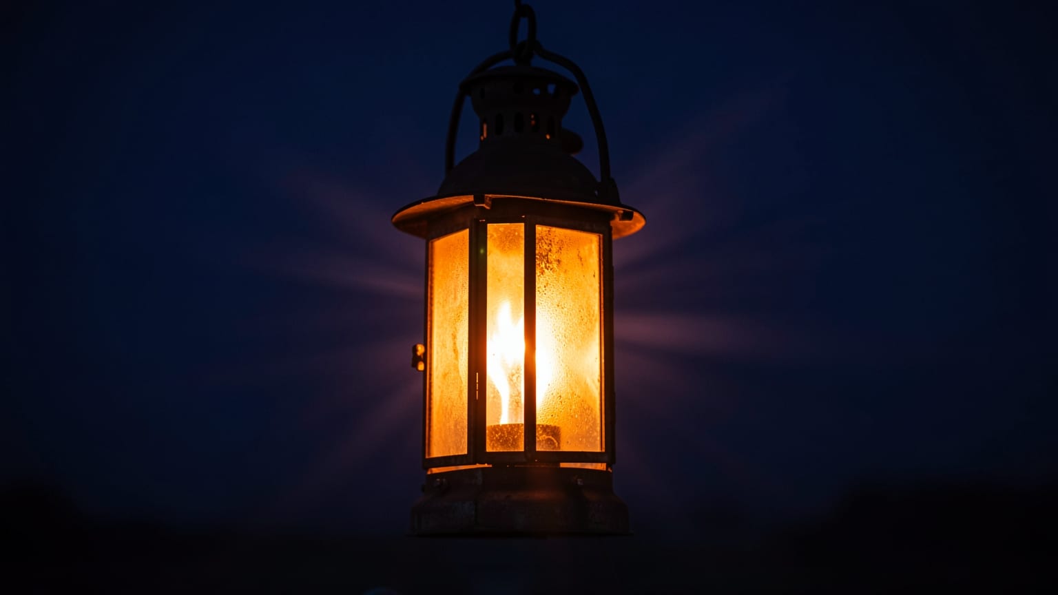 A lantern glowing behind frosted glass, its light spreading outward